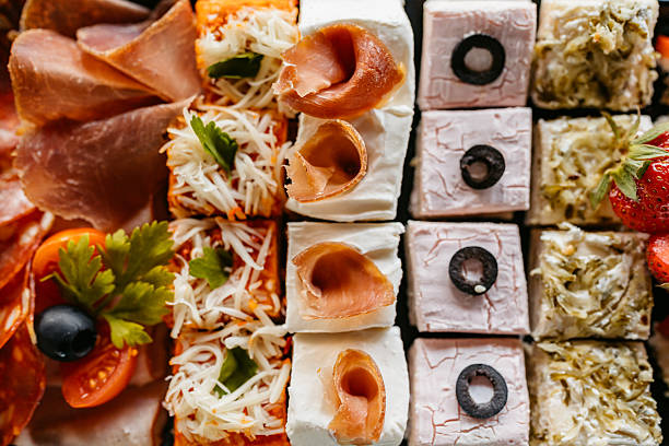 Gourmet appetizers arranged beautifully on a glass platter, showcasing vibrant colors and textures, perfect for a celebratory gathering