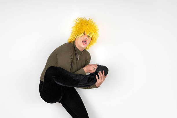 A playful woman in a silly pose with her leg up