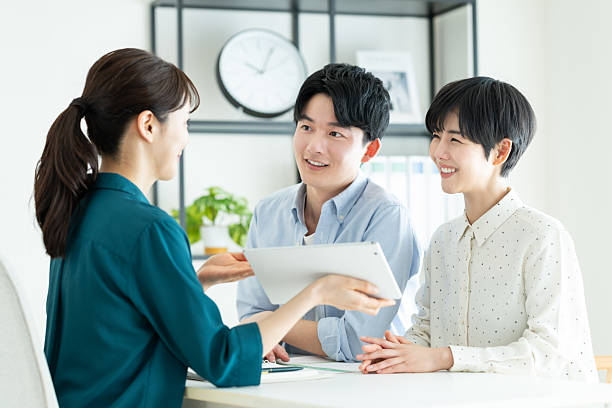 istock A young couple consulting with a planner in the office 2235919630