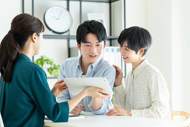 istock A young couple consulting with a planner in the office 2235919640