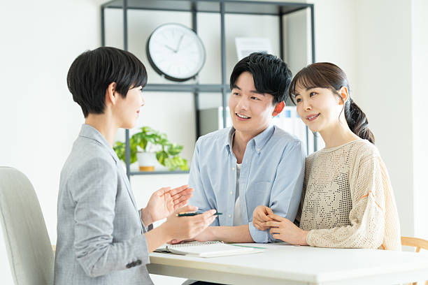 istock A young couple consulting with a planner in the office 2235919655