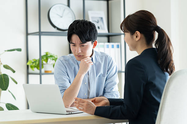 istock Young man consulting with consultant in office 2235920337