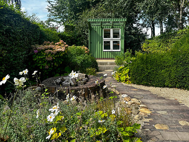 istock A garden with a stone path and a green shed used as a workshop 2235921022