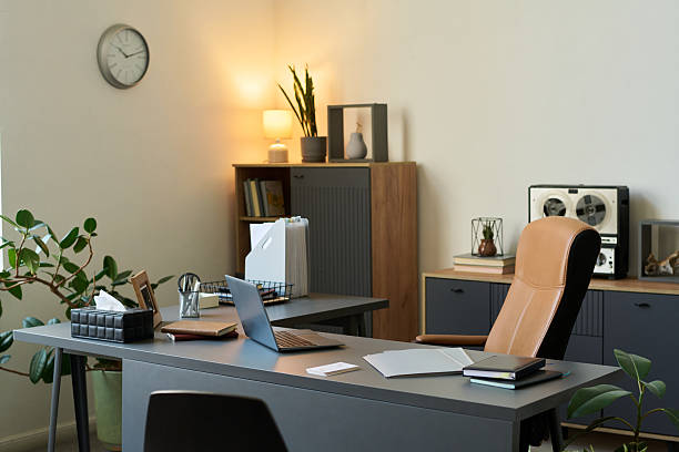 istock Empty Psychologist Office Interior Featuring Desk with Laptop and Paperwork 2235922860