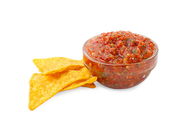 istock Delicious homemade red salsa with nachos isolated on white 2235923952