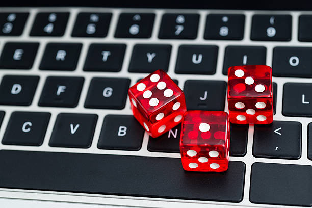istock Red dices on laptop keyboard 2235926382