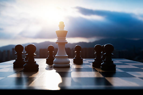 istock White chess king and black pawns on the chess board 2235926448