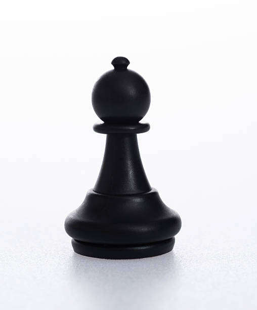 istock Black pawn chess piece on white background 2235926508