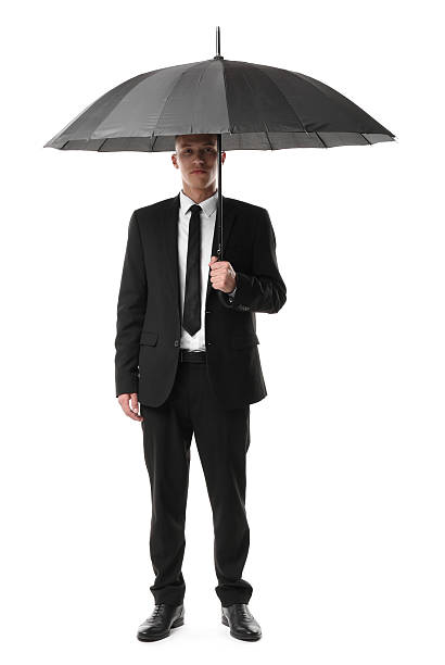 istock Man in suit with black umbrella on white background 2235926778