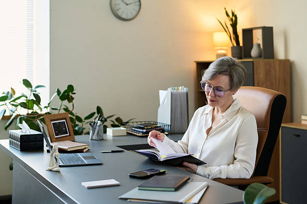 istock Woman Psychologist Reviewing Documents at Desk 2235927324