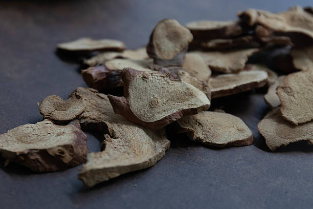 istock Dried Herbal Slices in Dark Bowl , Galangal 2235927861