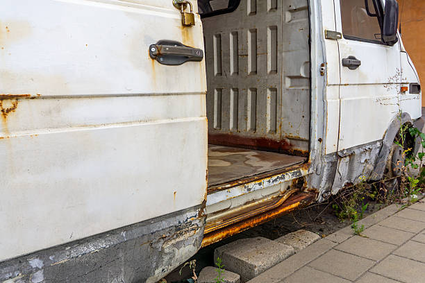 istock Old abandoned delivery van with open side door, rusty bodywork, and empty interior 2235928201
