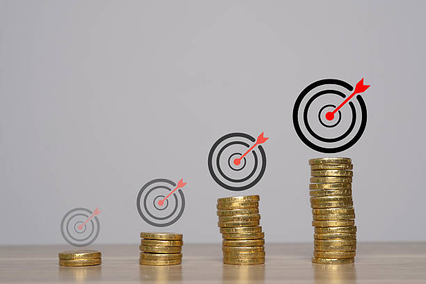 istock A visual representation of growth in finances, featuring stacked coins and target symbols indicating investment success. 2235930723