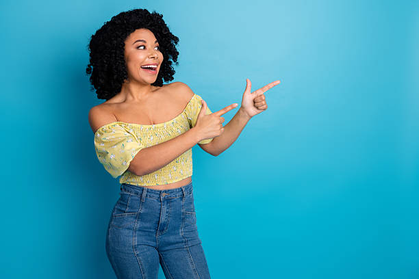 istock Charming young woman presenting a concept with gestures against blue background showing positivity and happiness 2235931287