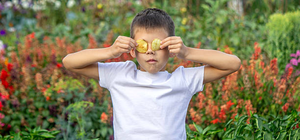 Boy eating chips from a pack. Unhealthy food concept.