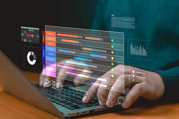 istock Hands typing on laptop with digital Gantt chart, calendar, and data dashboard, representing project management, workflow scheduling, productivity, task progress monitoring, and business efficiency. 2235938769
