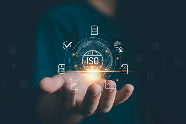 istock Hand holding glowing ISO certification icons with checklist, documents, and global standard symbol, representing quality assurance, compliance, audit process, international standards, and business 2235938877