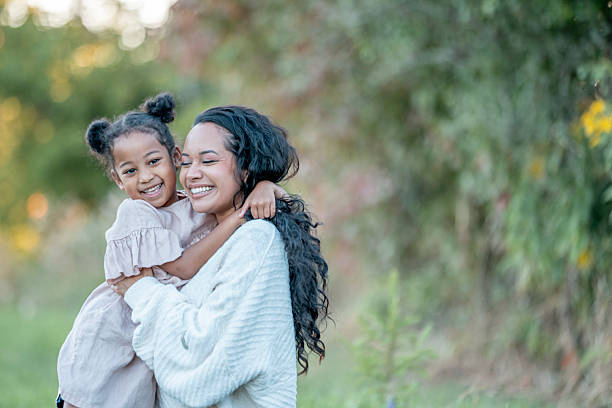istock Happy Mother and Daughter Bonding Outdoors in a Natural Setting 2235941040