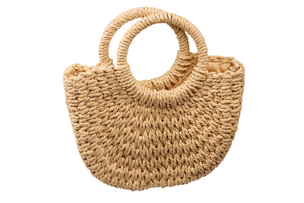 istock A beige straw bag isolated on a white background. 2235942649