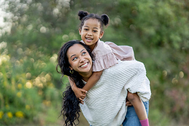 istock Mother and Daughter Sharing a Joyful Moment Outdoors Together 2235944009
