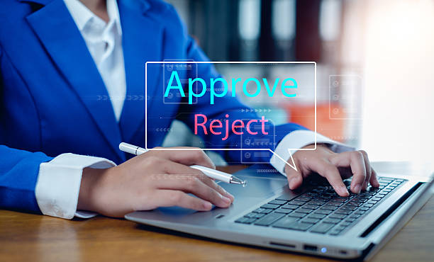istock Approved, accept, pass inspection, Businessman writing or tick correct mark to approve document and project concept. 2235945097