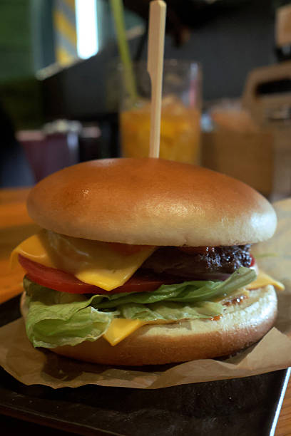istock Beef burger with cheese, tomato and lettuce 2235945276