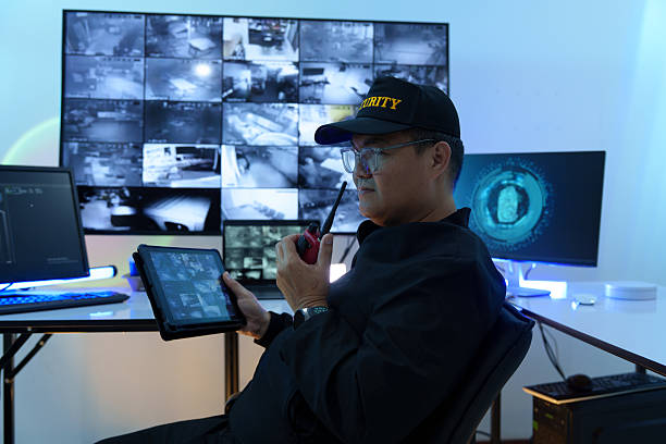 istock Security officers are checking the TV screen of the CCTV system. 2235947003