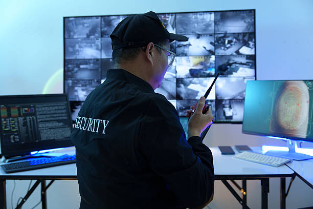 istock Security officers are checking the TV screen of the CCTV system. 2235947021