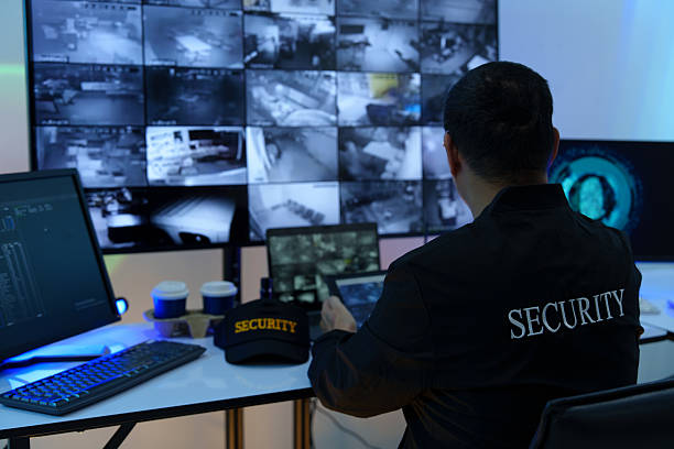 istock Security officers are checking the TV screen of the CCTV system. 2235947022