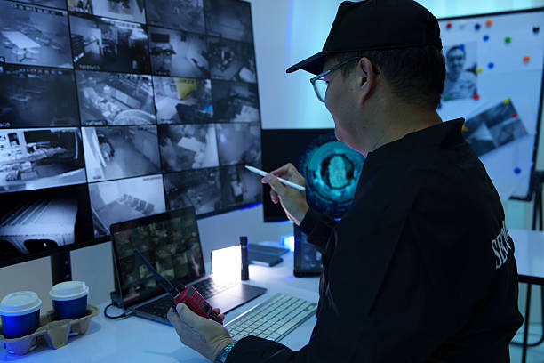 istock Security officers are checking the TV screen of the CCTV system. 2235947069