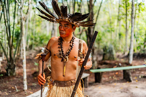 istock Curripaco indigenous with headdress holding traditional musical instruments 2235948120