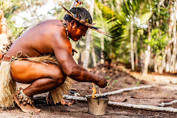 istock Curripaco indigenous man preparing harmonization ritual with sacred smoke 2235949321