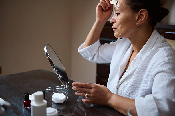 istock Woman Applying Face Mask in a Home Spa Setting 2235949444