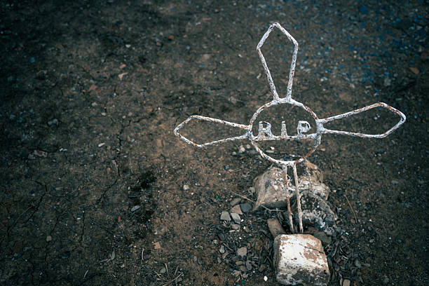 istock Rusty iron cross tomb in an old Spanish cemetery. 2235950043
