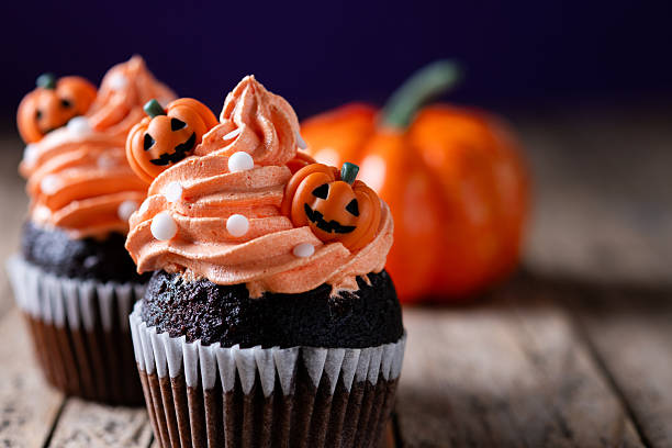 istock Halloween cupcakes with pumpkin decoration 2235950232