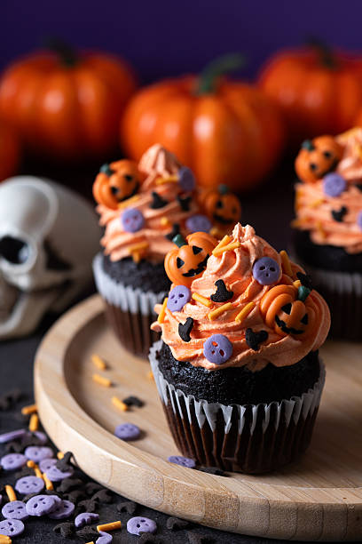 istock Halloween cupcakes with pumpkin sprinkles decoration 2235950362