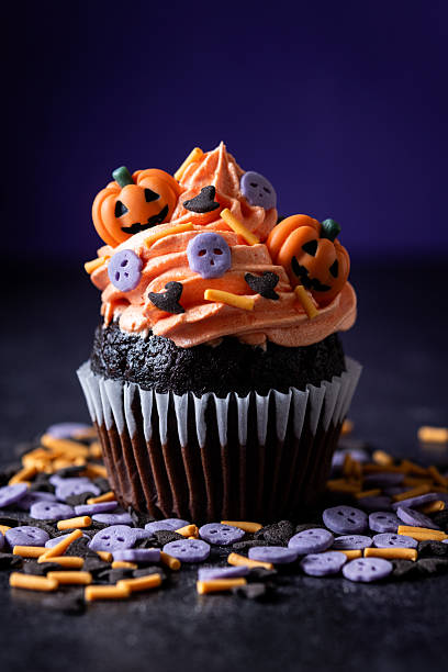 istock Halloween cupcakes with pumpkin sprinkles decoration 2235950408