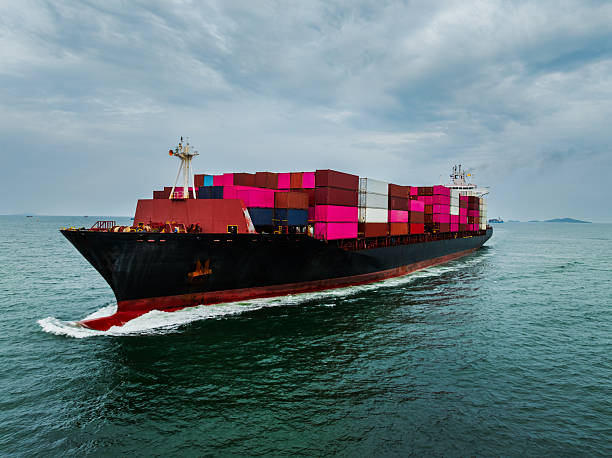 istock shipping logistic, cargo container ship sailing in sea, import export goods and distributing products to dealer and consumers across worldwide, by container ship Transport 2235950565