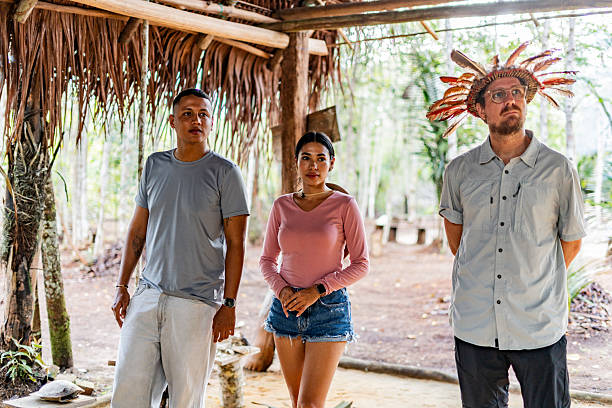 istock Tourists during cultural visit to Curripaco indigenous tribe 2235950743