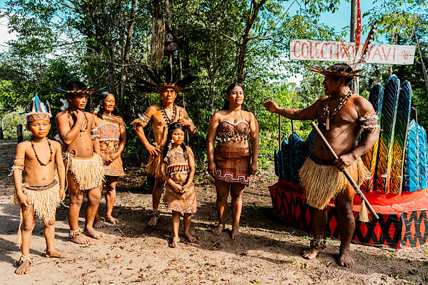 istock Group of Curripaco indigenous in community conversation at village 2235953669