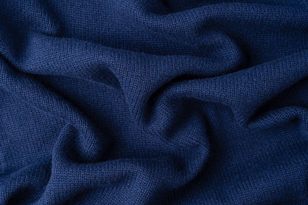 istock Navy blue merino wool sweater texture as background. Top view. 2235953802