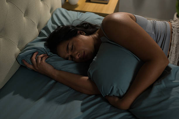 istock Woman suffering from insomnia and relationship problems in bed 2235956034