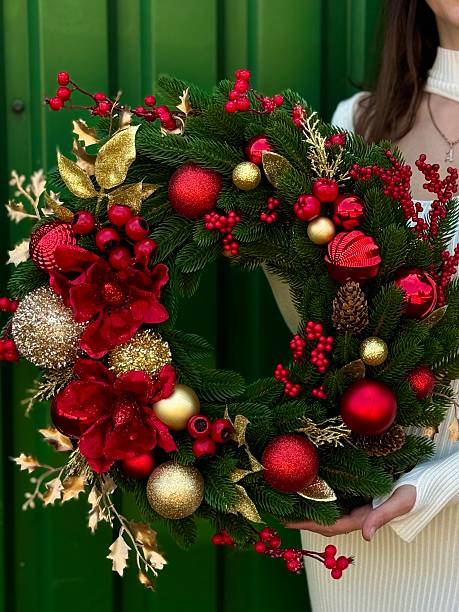 istock christmas wreath with red and gold ornaments 2235959032