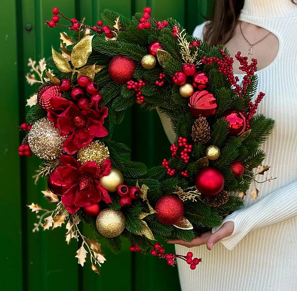 istock christmas wreath with red and gold ornaments 2235959041
