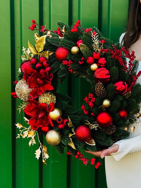 istock christmas wreath with red and gold ornaments 2235959055