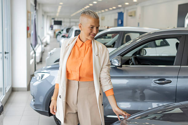 istock Married Couple in a Car Showroom 2235961759