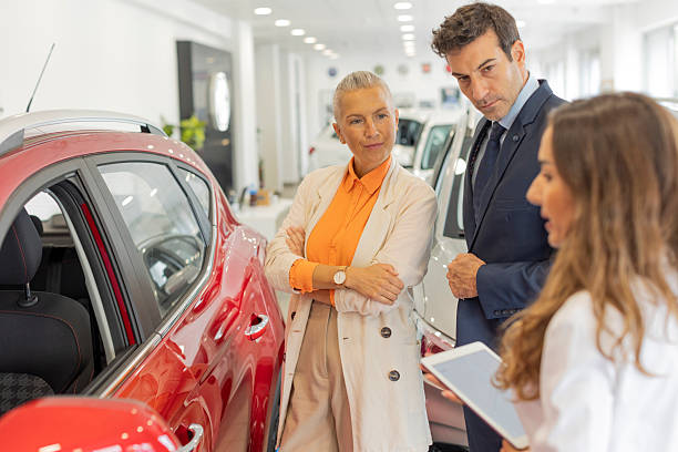 istock Married Couple in a Car Showroom 2235962028
