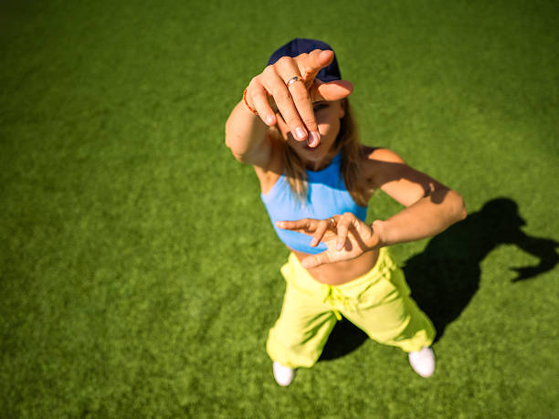 istock Woman Reaching Toward Camera with Blurred Face, Focus on Hand 2235966341