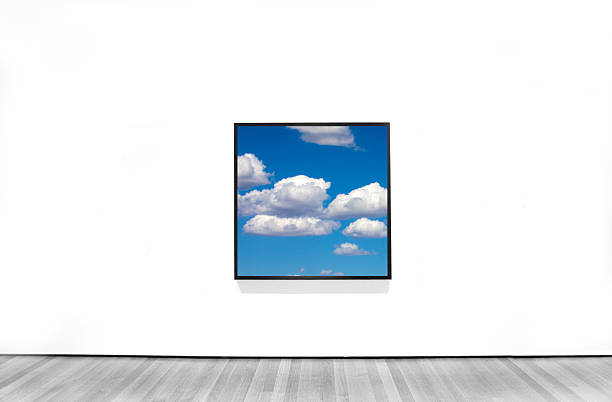 USA New York,   framed photograph of blue sky and clouds hanging on a wall