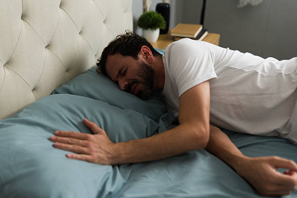 istock Emotional man crying in bed after breakup 2235968618